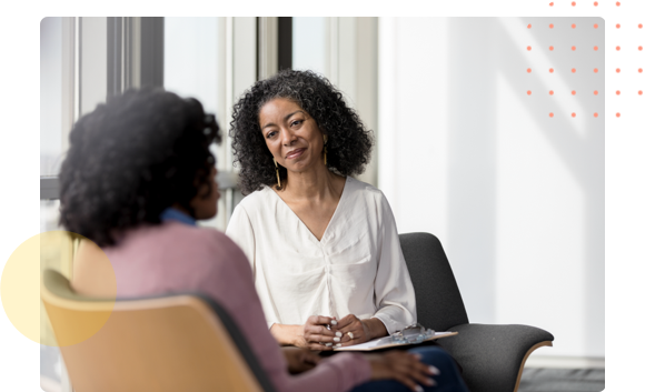 Behavorial health medical professional sitting with a patient - HealthStream